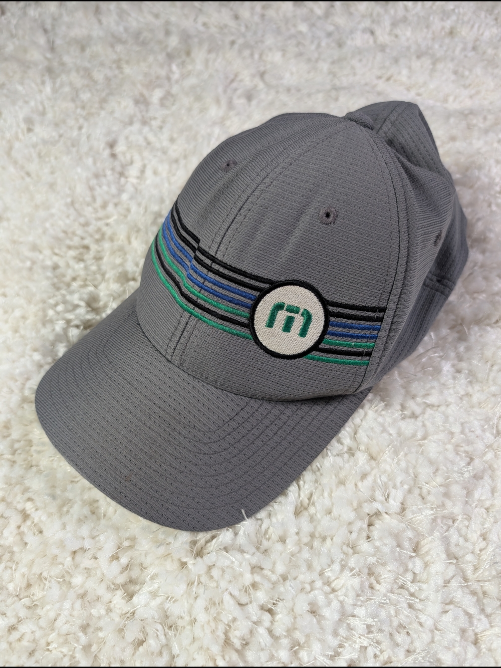 Travis Mathew Cap with Green & Blue Stripe Emblem